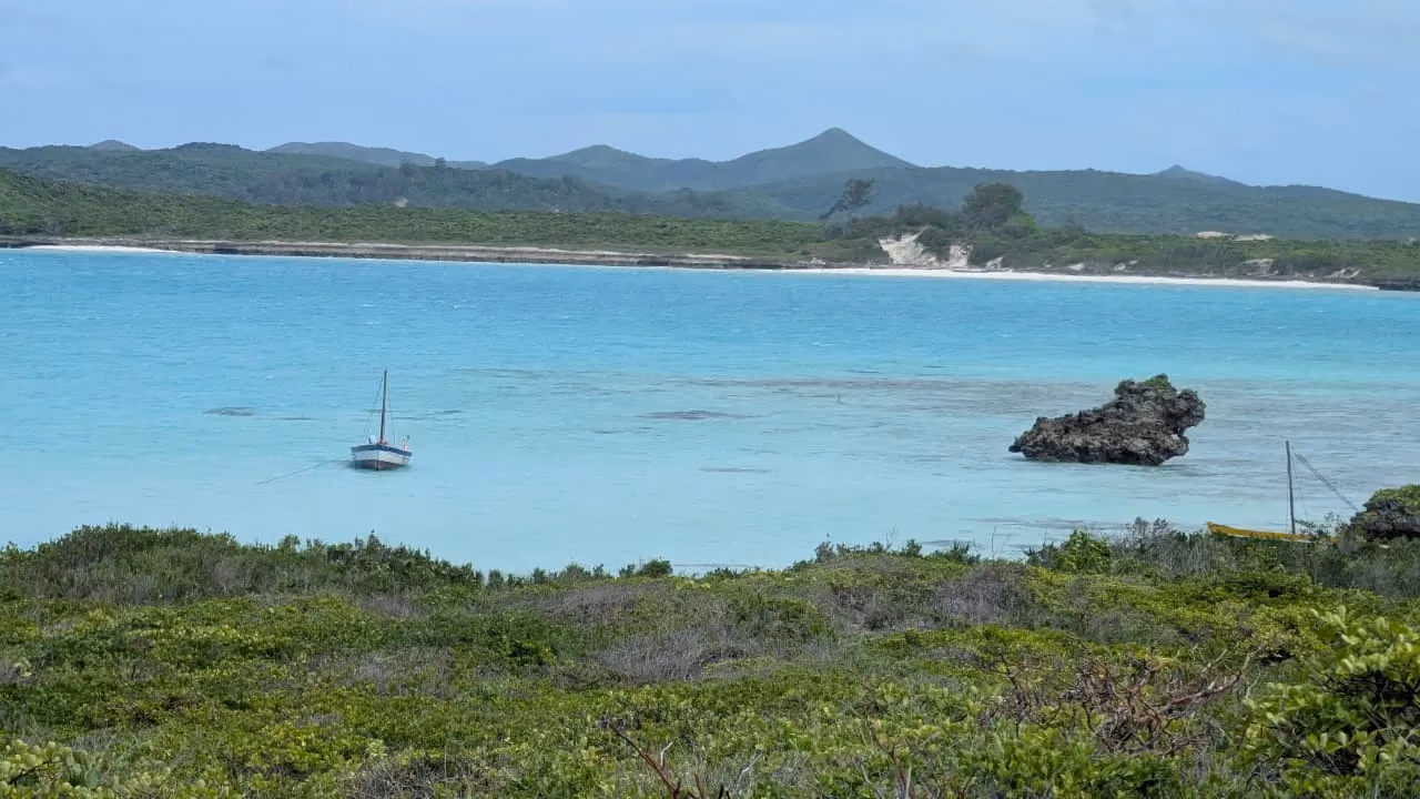 Boat on the turquoise shallow water of the Emerald Sea