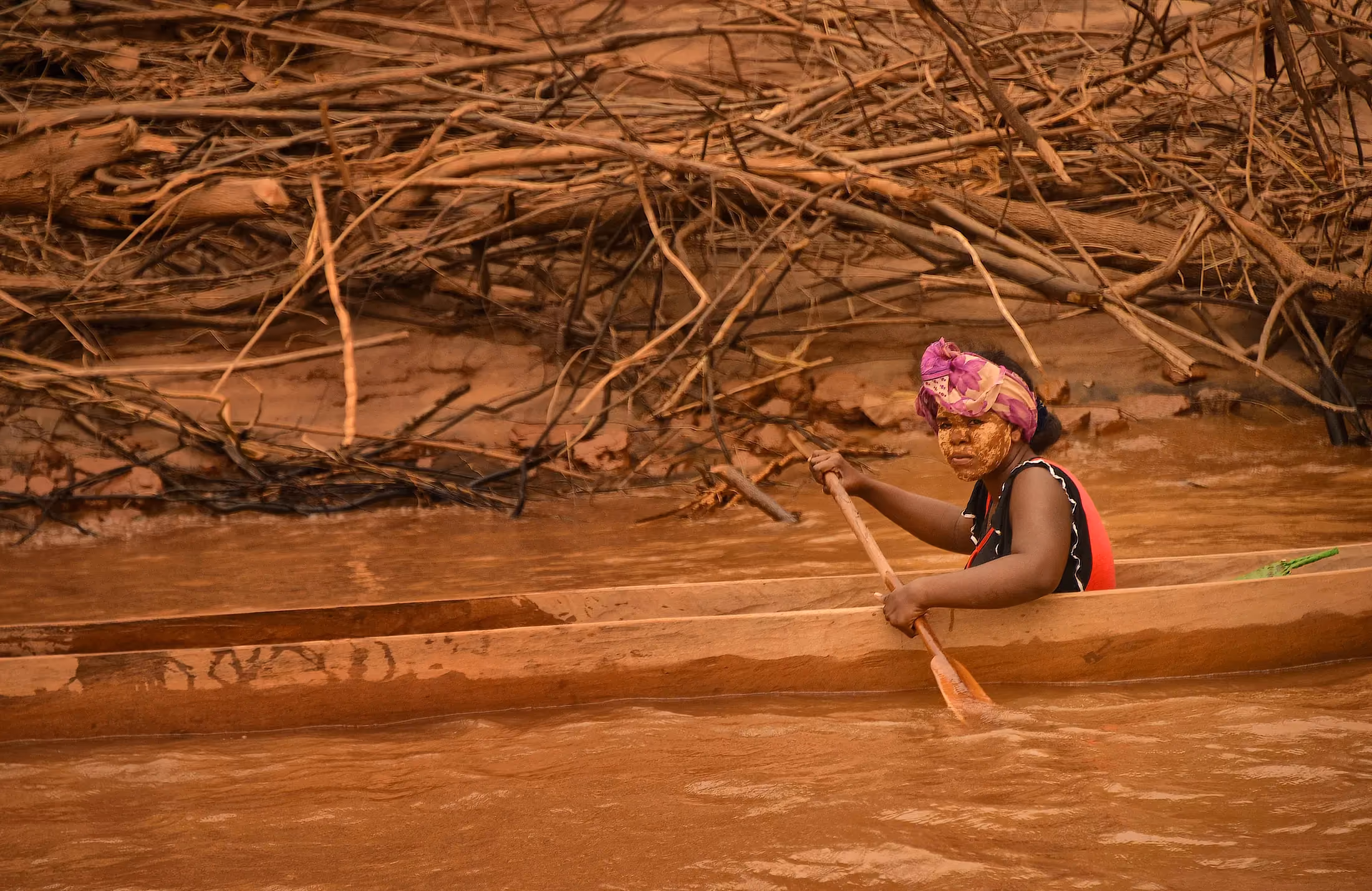 Traditional pirogue on a turquoise lagoon in Madagascar